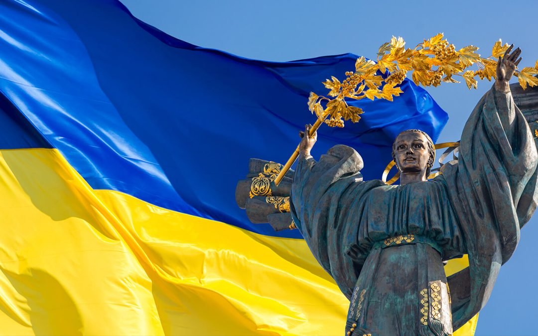 Ukrainian lady liberty and ukrainian flag